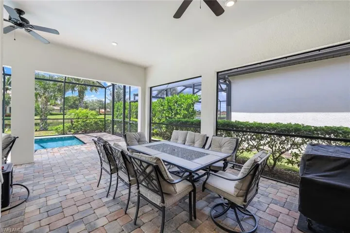 Sunroom / solarium featuring ceiling fan