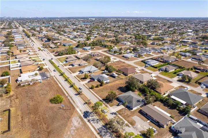 Aerial overview of property's location with nearby suburban area