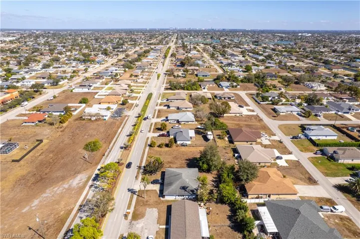 Aerial overview of property's location with nearby suburban area