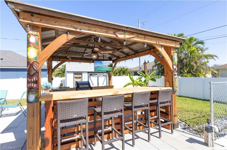 Custom Tiki Bar wtih mini fridge, grill, and so much more.