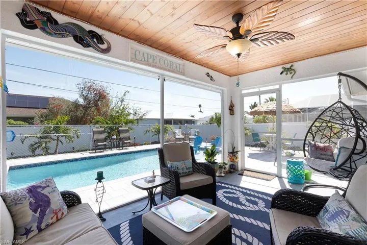 Sunroom / solarium with wooden ceiling and ceiling fan