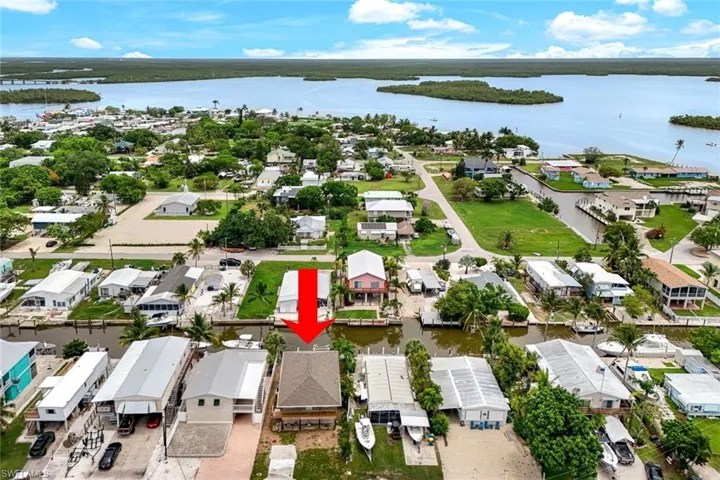 Aerial view of residential area with a nearby body of water