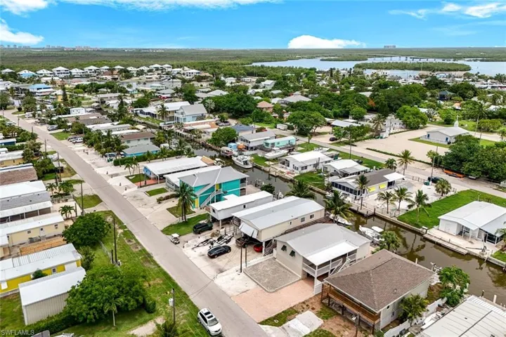 Aerial perspective of suburban area with a nearby body of water