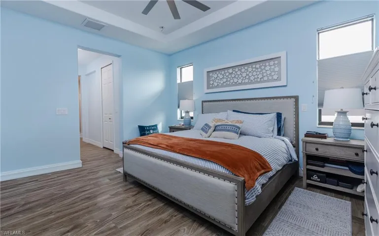 Bedroom with wood finished floors and ceiling fan