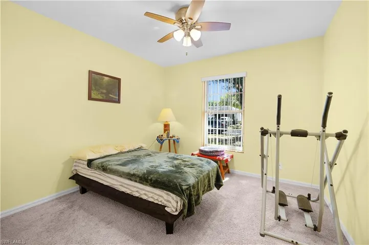 Bedroom with carpet flooring and ceiling fan