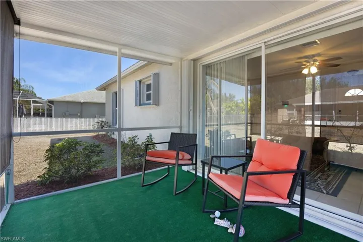 Sunroom / solarium featuring a ceiling fan and healthy amount of natural light