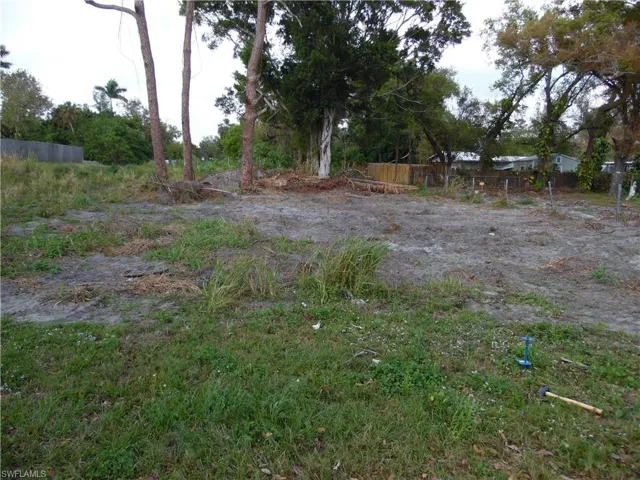 View of yard featuring fence
