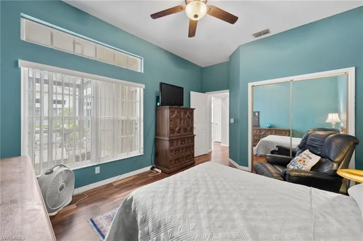 Bedroom featuring a closet, ceiling fan, and hardwood / wood-style floors