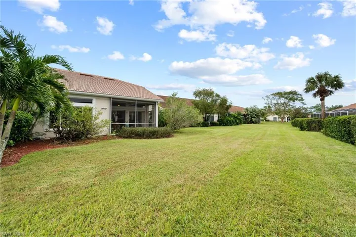 View of yard with a sunroom