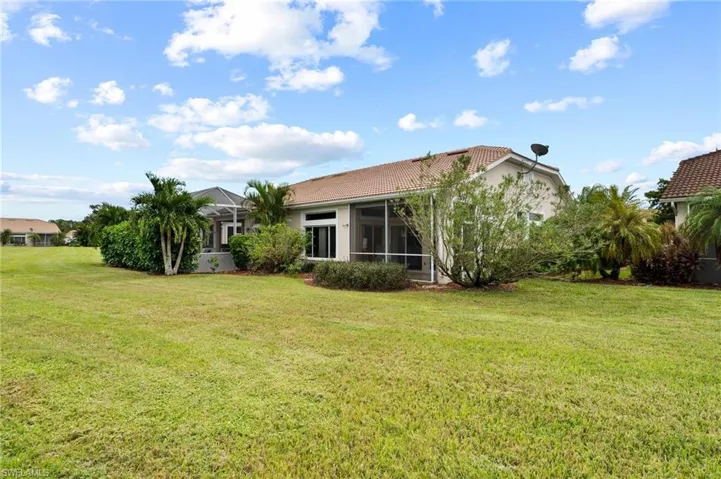 View of yard with a sunroom
