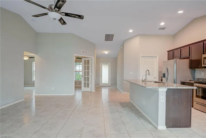 Kitchen featuring a sink, stainless steel appliances, visible vents, and a ceiling fan