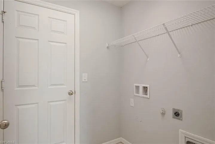 Laundry room with laundry area, hookup for an electric dryer, baseboards, and washer hookup