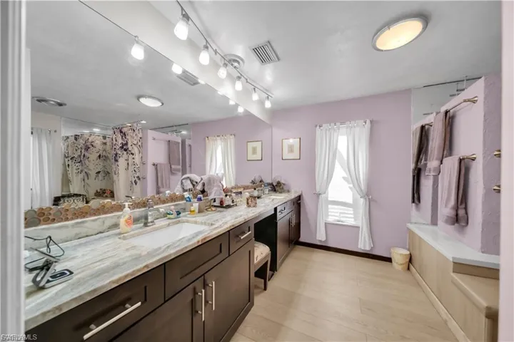 Dual vanity with undermount sinks and light-toned countertops