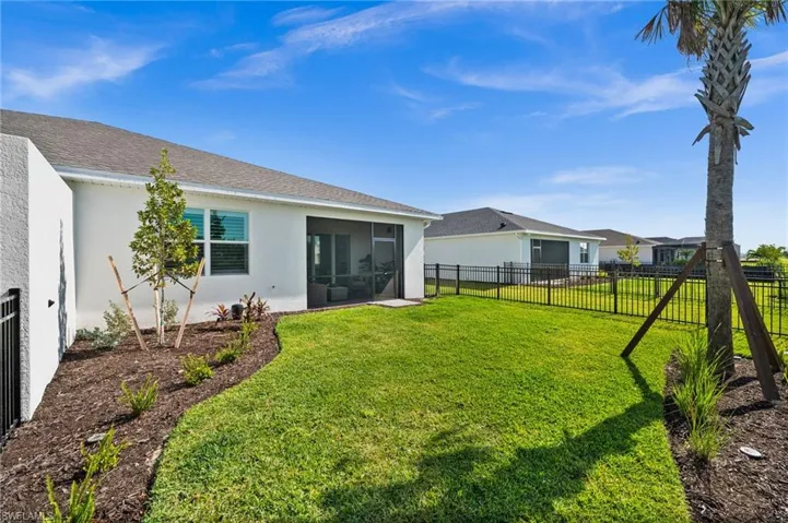 View of yard featuring a sunroom and fence private yard