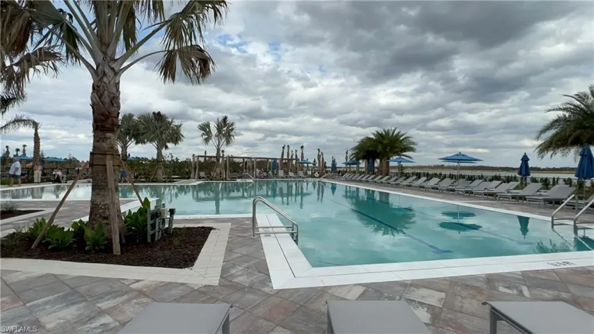 Community pool featuring a patio