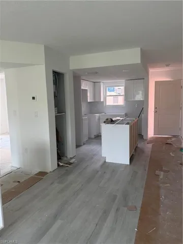 Kitchen with a kitchen island and white cabinets