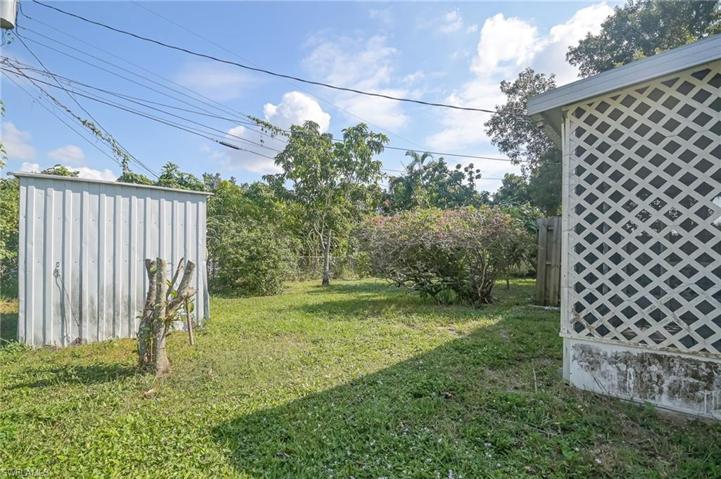 Big back yard with storage shed.