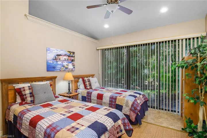 Bedroom with lofted ceiling, a ceiling fan, crown molding, and recessed lighting
