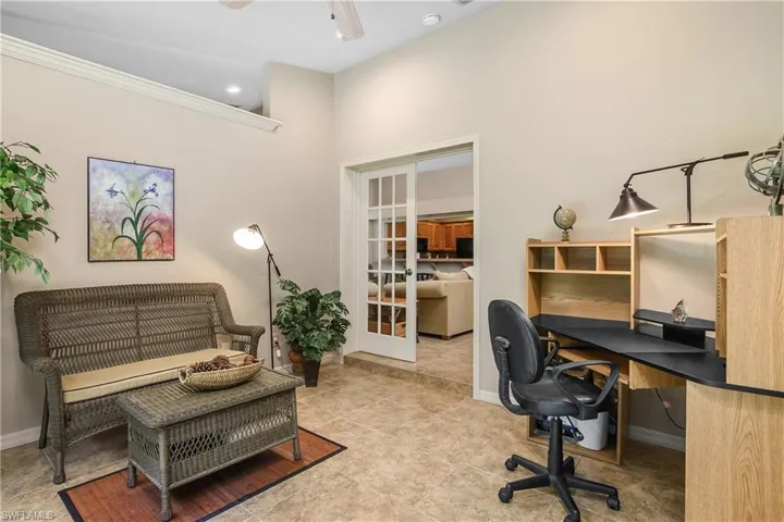 Tiled office featuring french doors, baseboards, a ceiling fan, ornamental molding, and recessed lighting