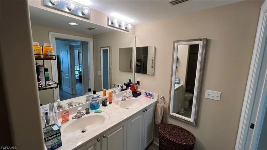 Bathroom featuring vanity and toilet