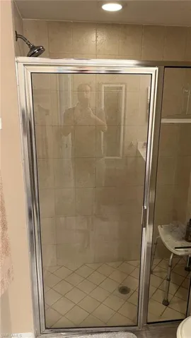 Bathroom featuring a shower with shower door