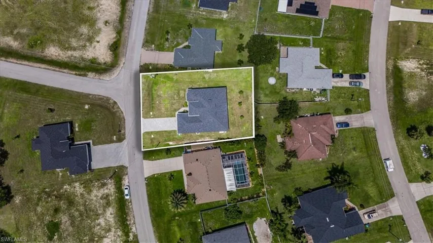 Aerial overview of property's location featuring nearby suburban area