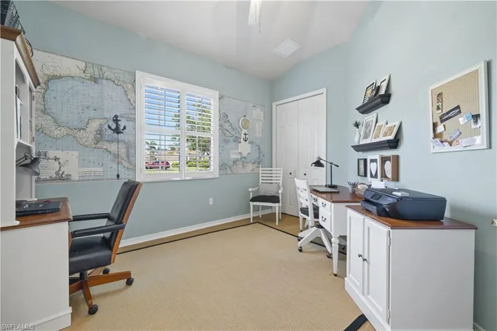 Office featuring vaulted ceiling