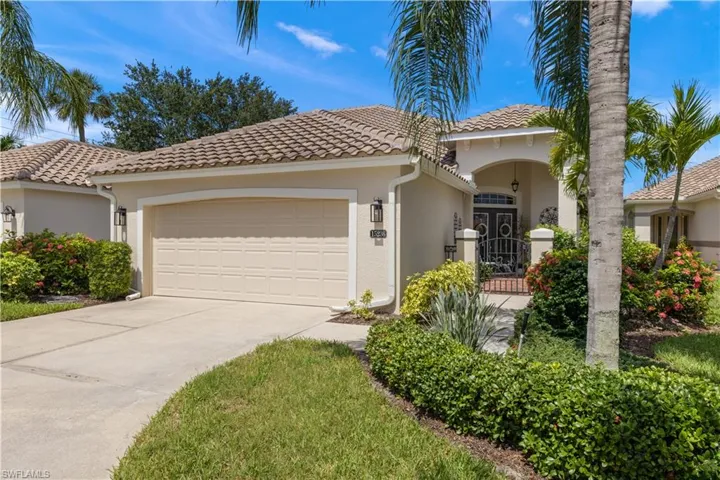 Mediterranean / spanish-style house featuring a garage