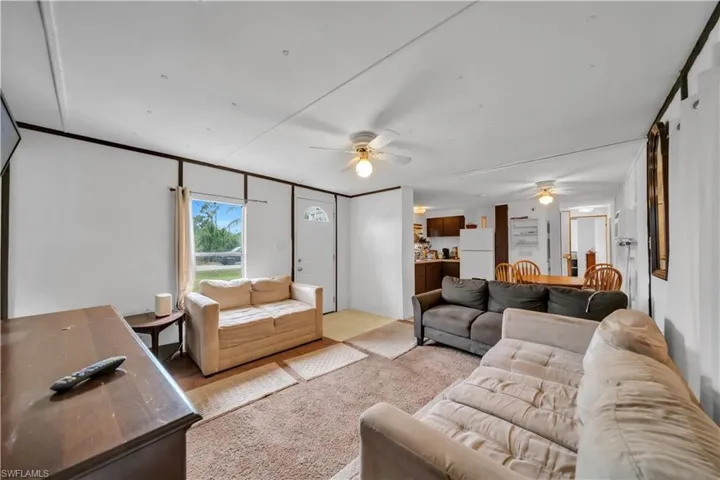 Living area featuring a ceiling fan