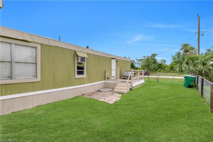 View of yard featuring a wooden deck