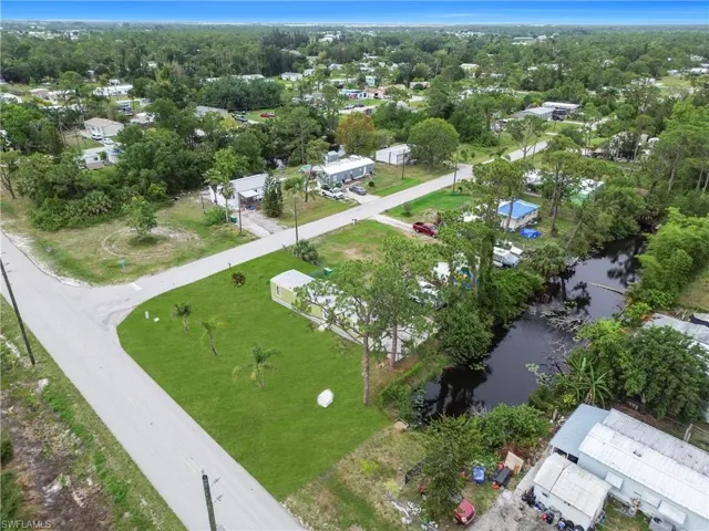 Aerial overview of property's location featuring a nearby body of water