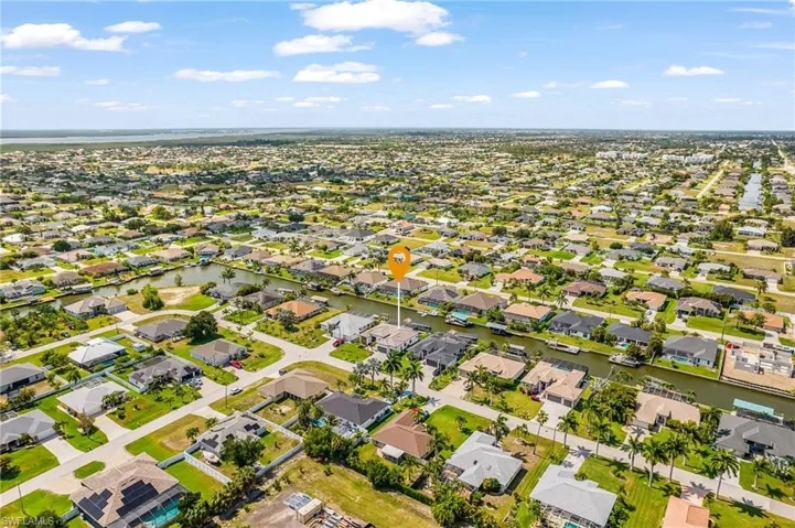 Aerial perspective showcasing a residential community with numerous properties