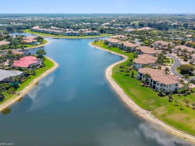 Aerial perspective of suburban area with a nearby body of water