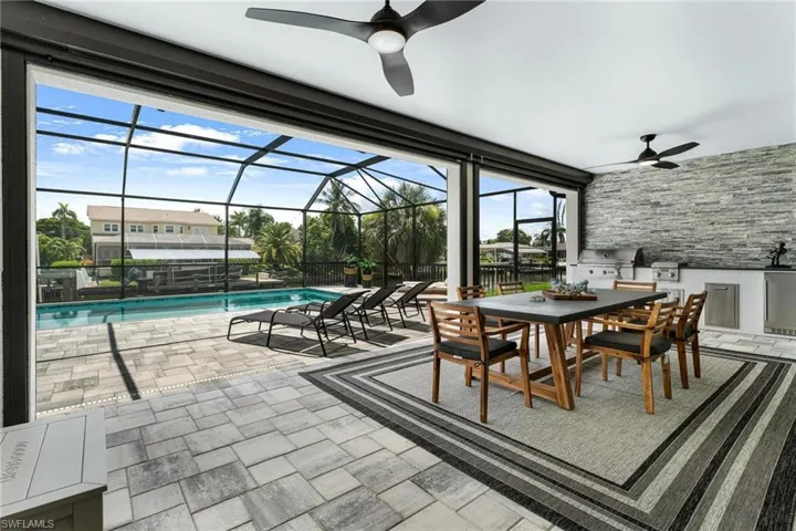 Sunroom / solarium featuring ceiling fan