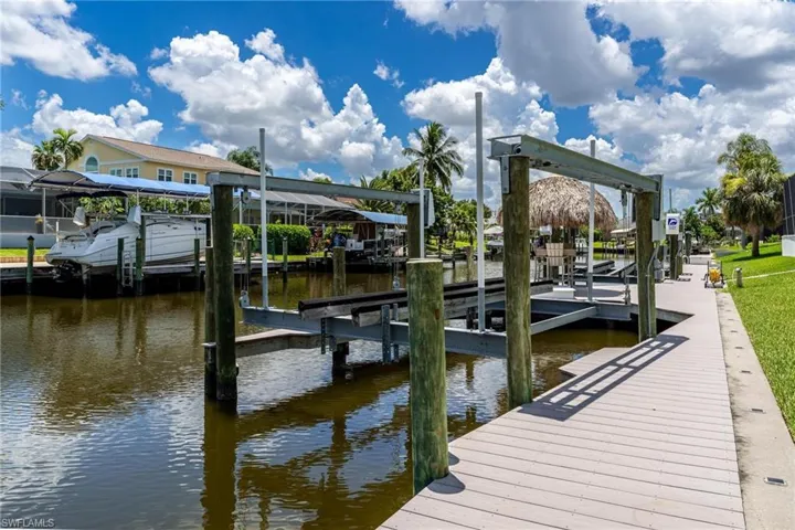 Dock area featuring a water view