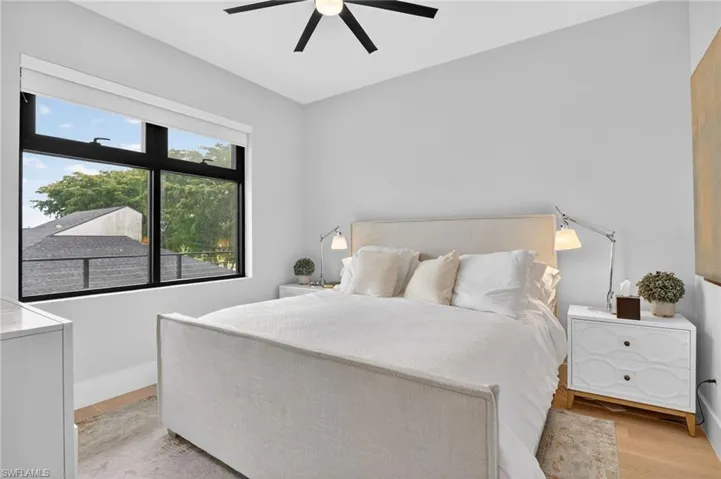 Bedroom featuring light wood-style floors and ceiling fan