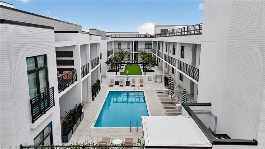 Community pool featuring a patio area