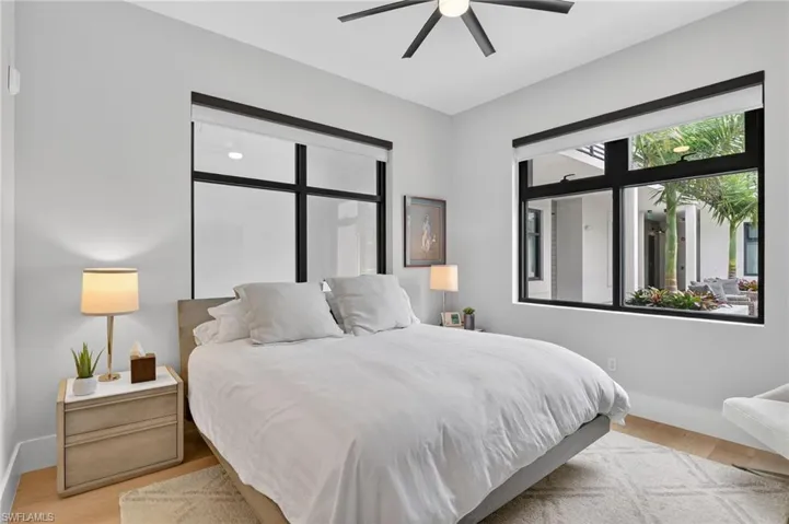 Bedroom featuring light wood-style flooring and a ceiling fan