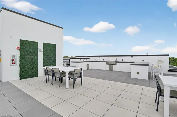 View of patio featuring outdoor dining area and exterior kitchen
