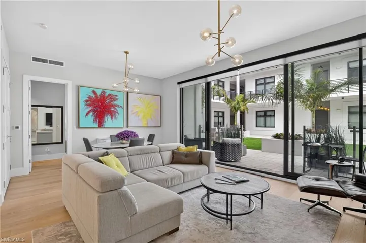 Living room featuring a chandelier and light wood-style flooring
