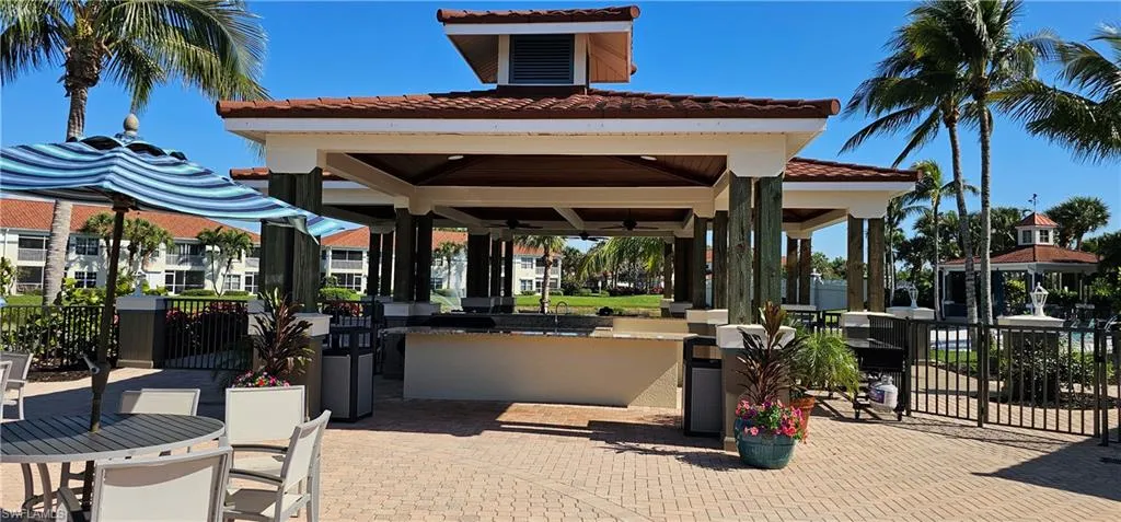 Community barbecue area, bar, gazebo by beach and pool area