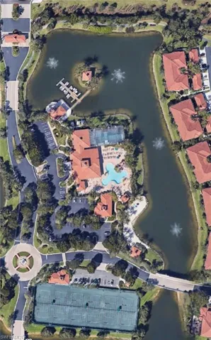 Aerial view of boat house, tennis courts, enclosed lap pool, beach, clubhouse with resort style pool, amenities center.