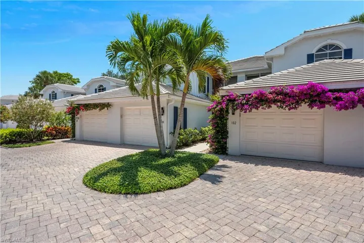 View of Front of Property featuring Stucco Siding and Decorative Brick Paver Driveway
