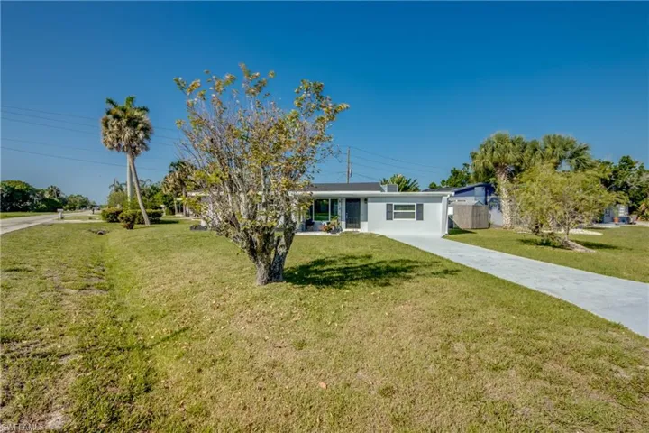 Ranch-style home with a front lawn