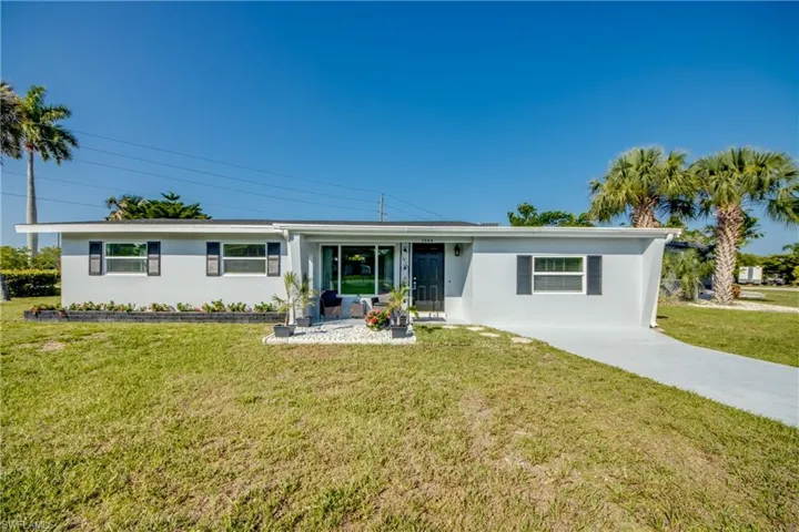 Single story home featuring a front yard