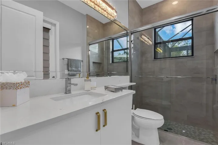 Pool Bath off Family Room w/ Entry Door To Outdoor Living Space