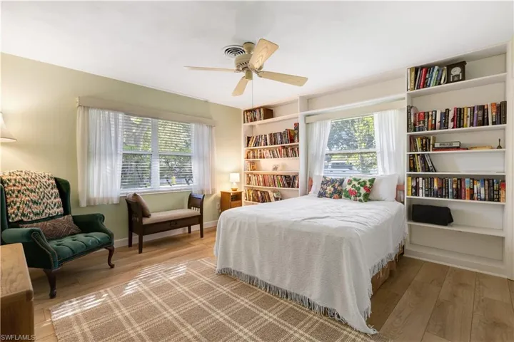 Bedroom with light wood-style floors and ceiling fan