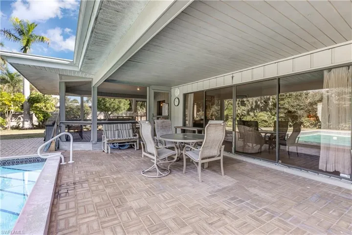 View of patio / terrace featuring an outdoor pool and outdoor dining space