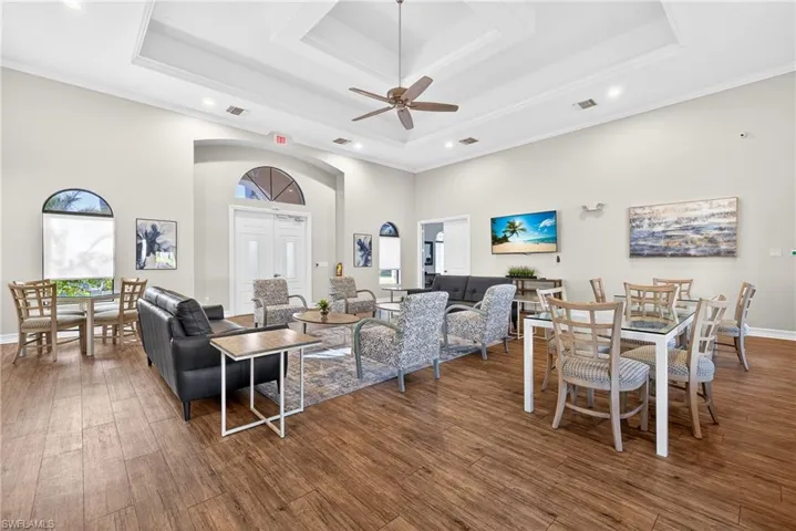 Amenity-rich Naples gated community of Andalucia featuring clubhouse, fitness center, social room, playroom, playground, and resort-style pool