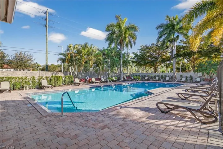 Amenity-rich Naples gated community of Andalucia featuring clubhouse, fitness center, social room, playroom, playground, and resort-style pool